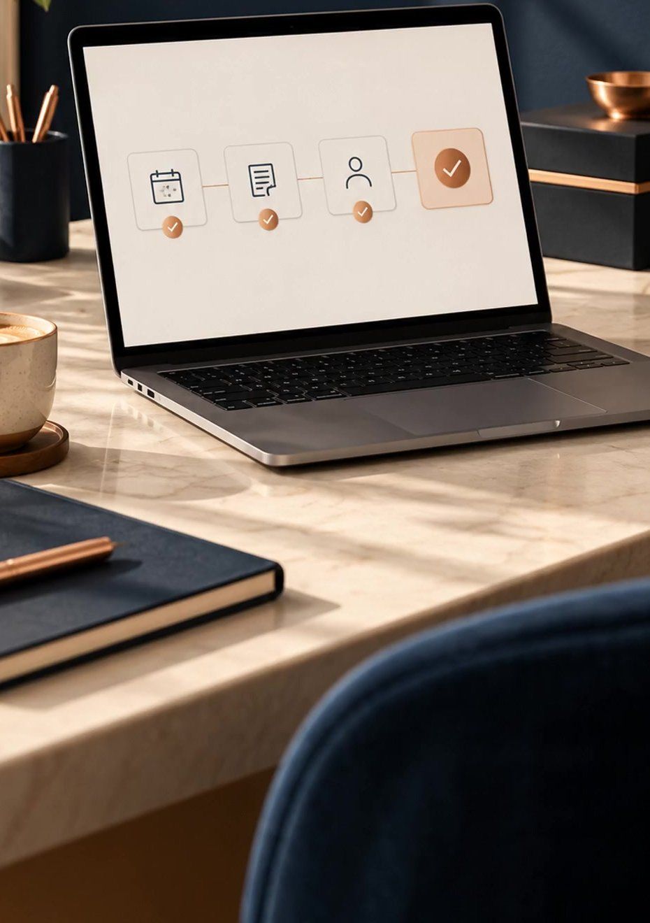 A calm desk with a laptop showing a four-step workflow, a coffee and a navy notebook